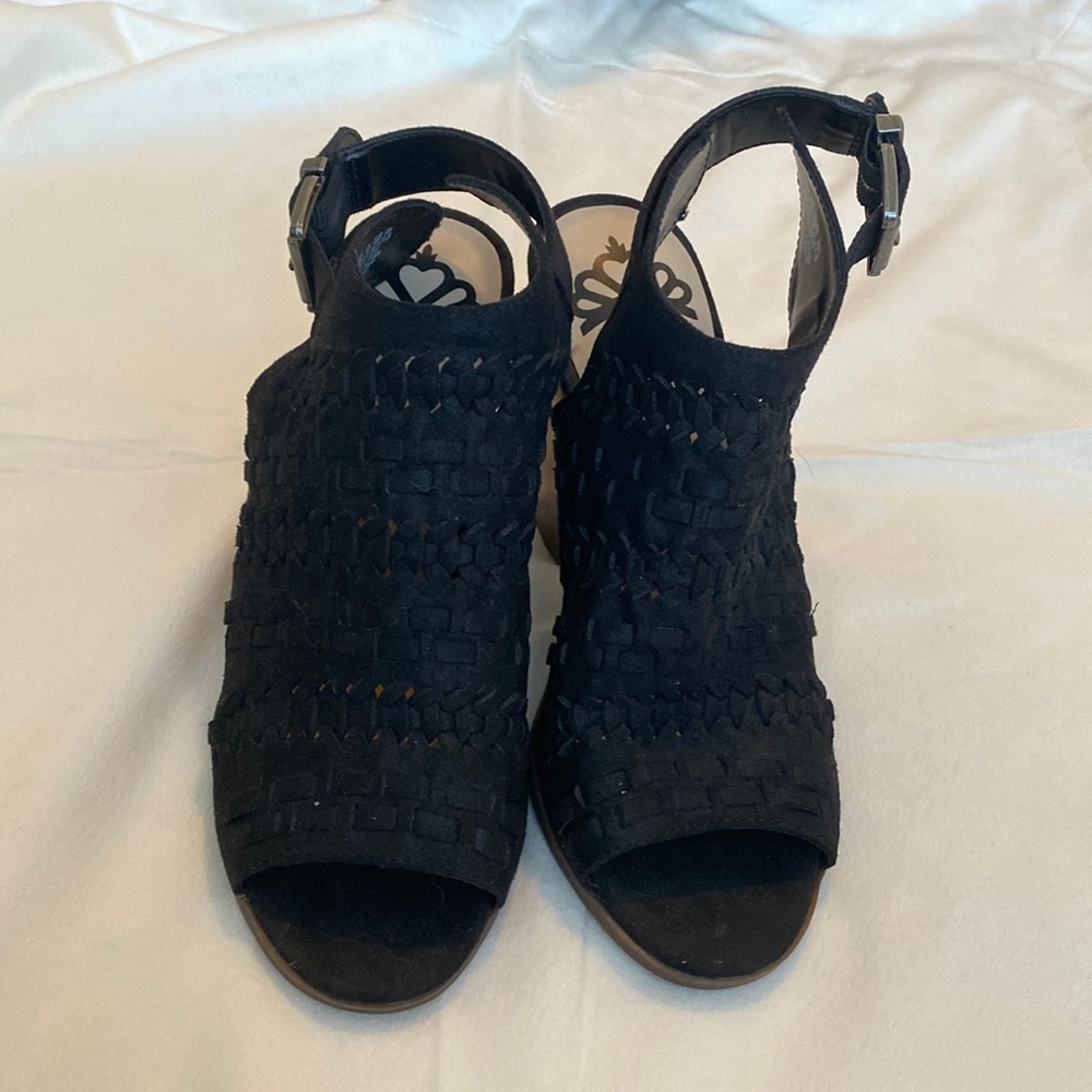 Open-toe black booties.